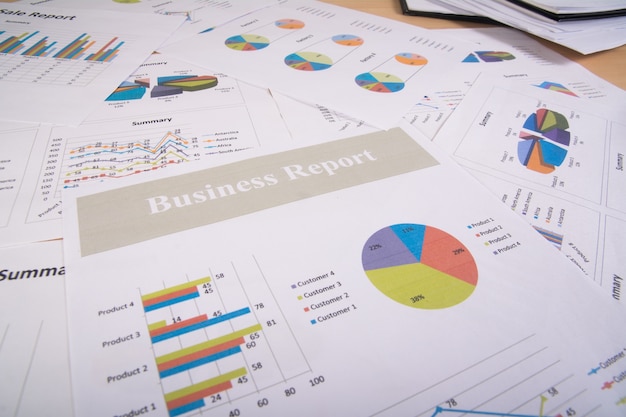 Free photo business report. graphs and charts. business reports and pile of documents. business concept.