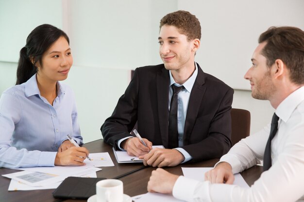 Business Team Discussing Ideas at Meeting