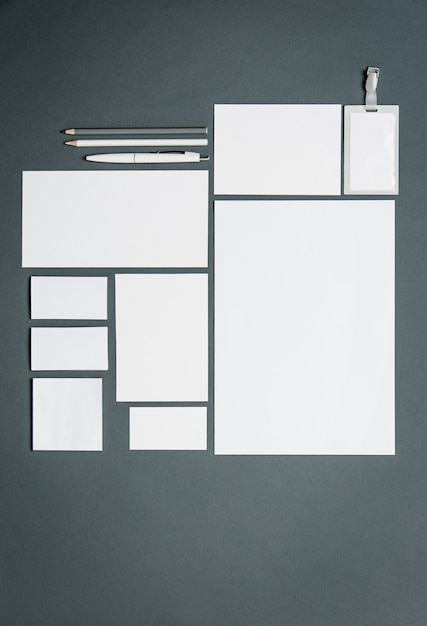 Free Photo business template with cards, papers, pen. gray space.