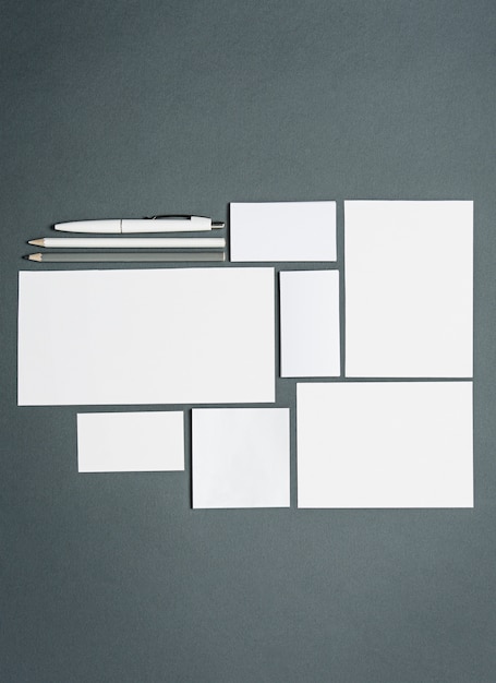 Free photo business template with cards, papers, pen. gray space.