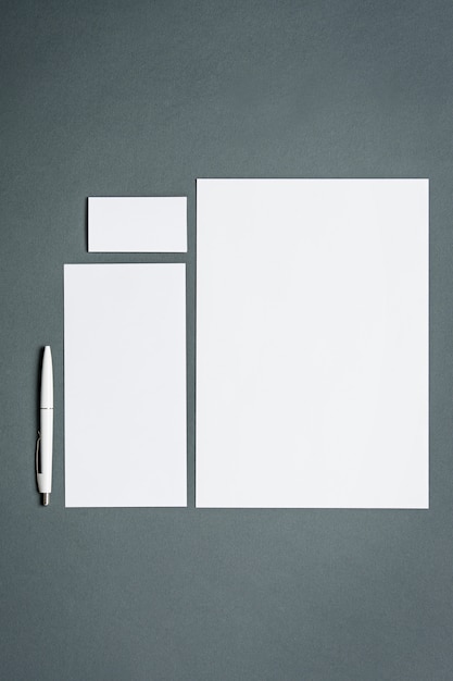 Free photo business template with cards, papers, pen. gray space.