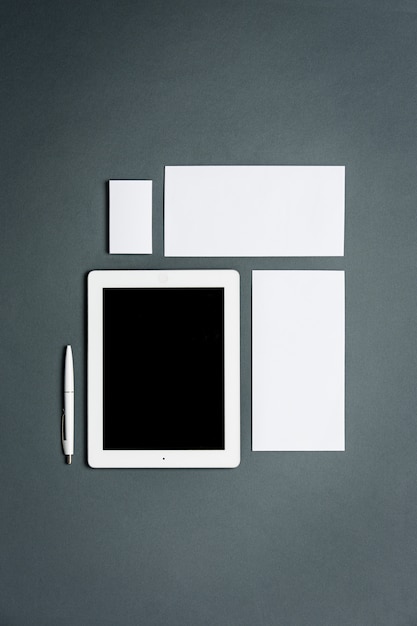 Free Photo business template with cards, papers, tablet. gray space.