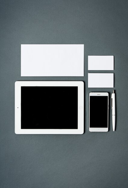 business template with cards, papers, tablet. Gray space.