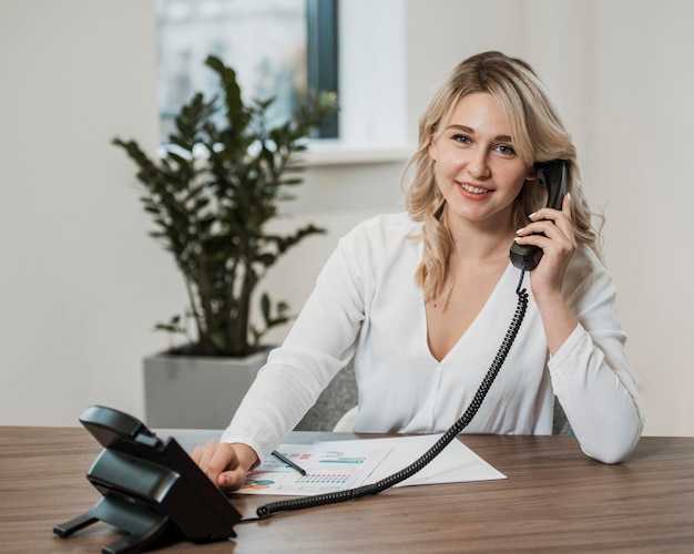 Business woman answering the phone