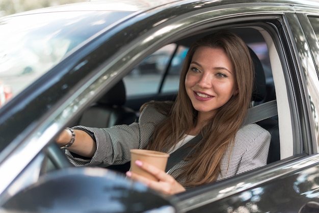 Business woman driving a car