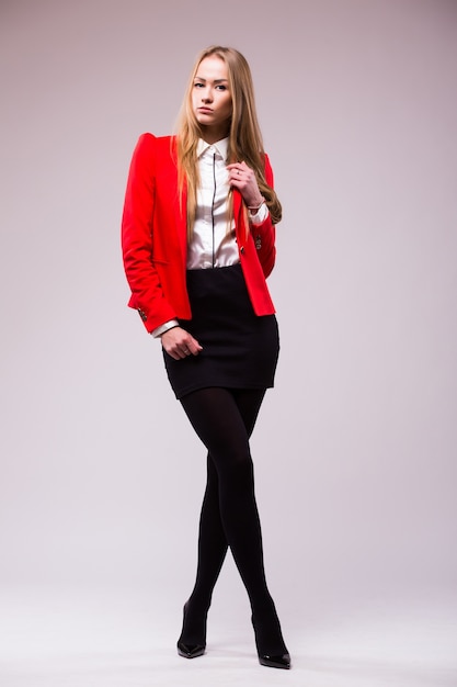 Business woman full body standing isolated on white wall with copy space.