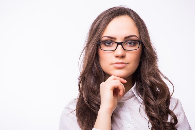 Business woman in glasses isolated on white wall