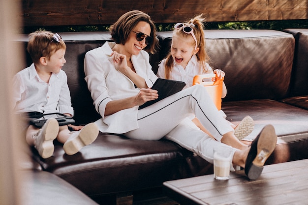 Business woman mother working from home with kids