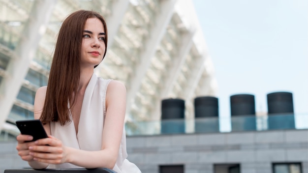 Business woman posing in the street