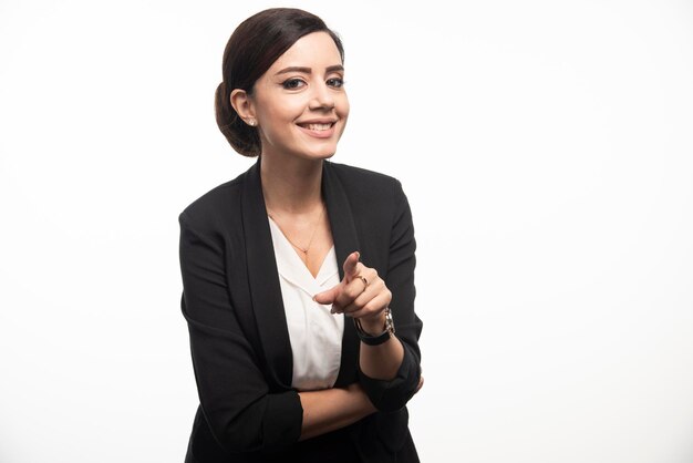 Business woman posing in suit on a white background. High quality photo