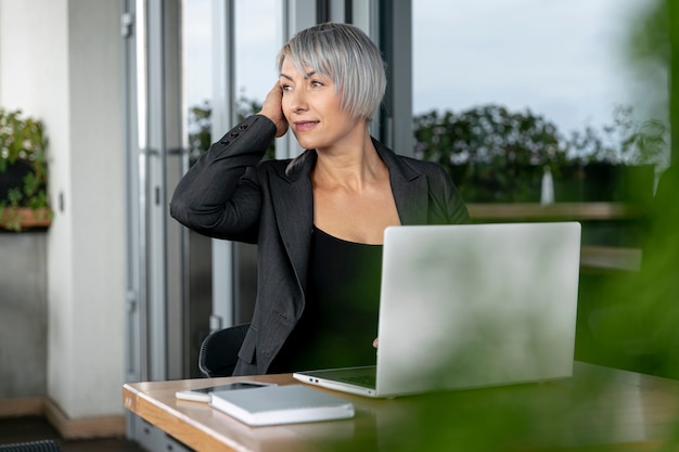 Business woman sitting and looking away