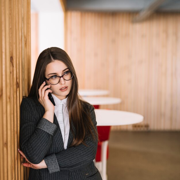 Business woman talking by phone 