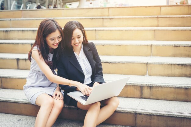 Business woman talking or Conversation while working sitting  Outdoor.