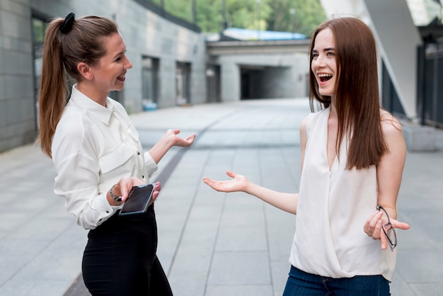 Business woman together at the street