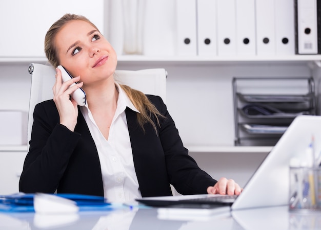 Business woman using phone