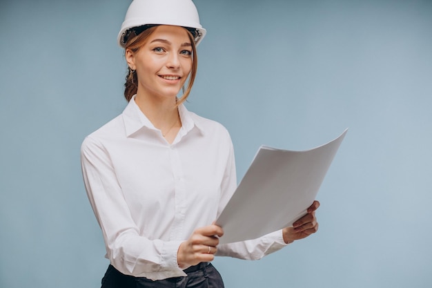 Free photo business woman wearing safety hat and holding papers