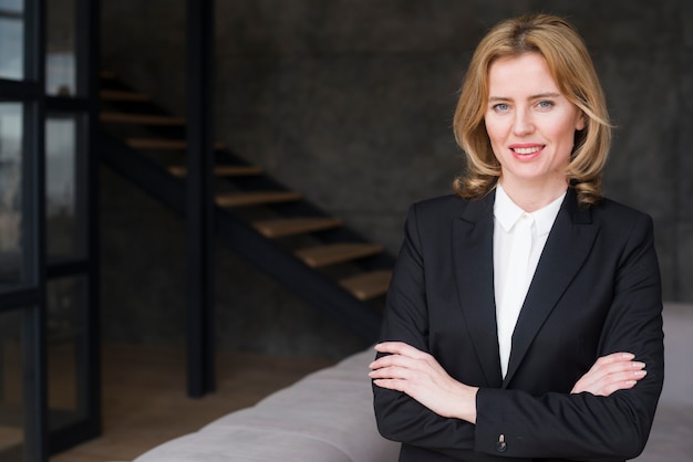 Business woman with crossed arms smiling