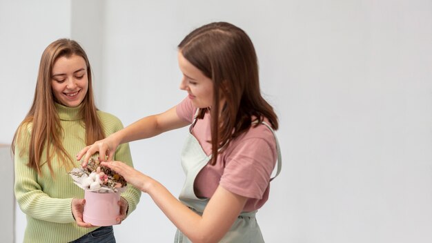 Business women making a bouquet copy space