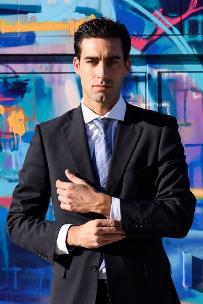 Businessman adjusting his sleeve