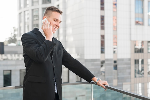 Businessman calling on smartphone