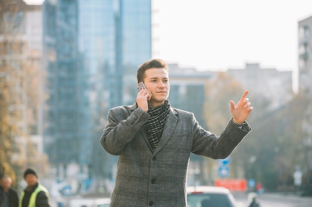 Businessman calling a taxi