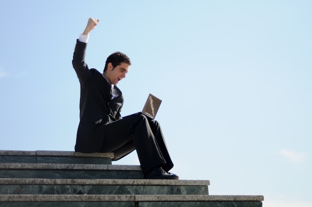 Free photo businessman celebrating his success