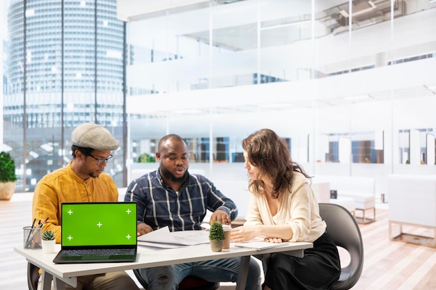 Free Photo businessman discussing with the real estate agents next to chroma key