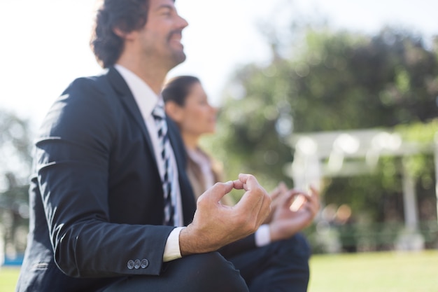 Free photo businessman doing relaxation exercises