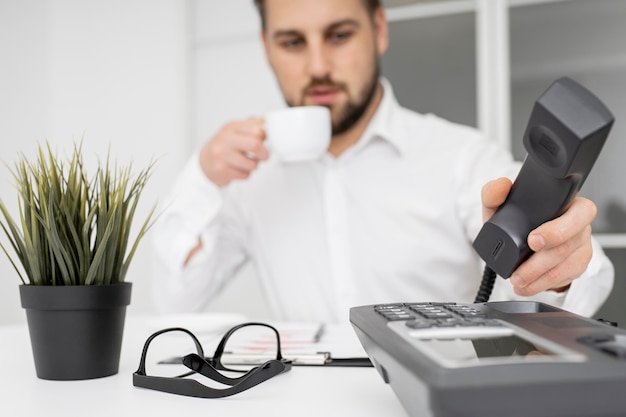 Businessman enjoying coffee at the office