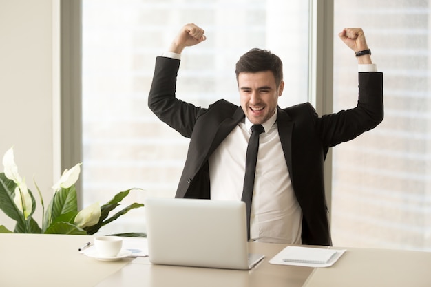 Businessman excited because of achievement in business