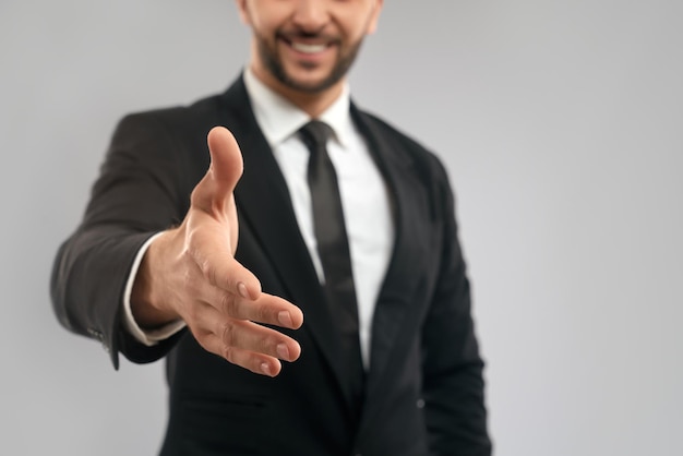 Free photo businessman giving hand for shake