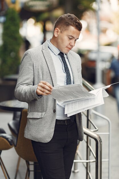 Businessman. Guy in a suit. Male with a documents.