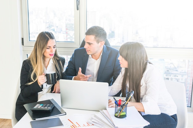 Businessman having discussion with businesswoman in the meeting