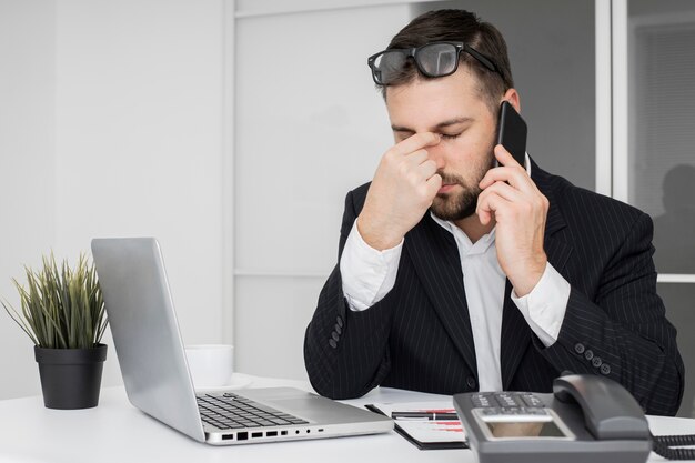 Businessman having a hard day at the office