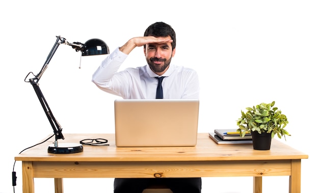 Businessman in his office showing something