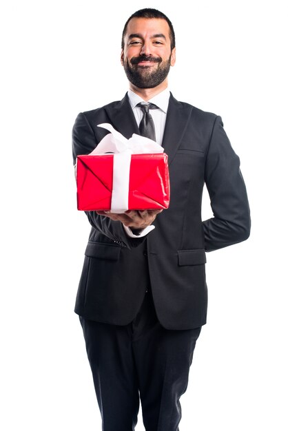 Businessman holding a gift