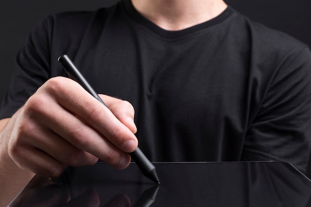 Businessman holding tablet and writing an invisible screen with stylus social media cover