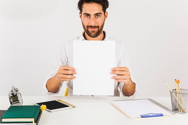 Businessman holding white paper