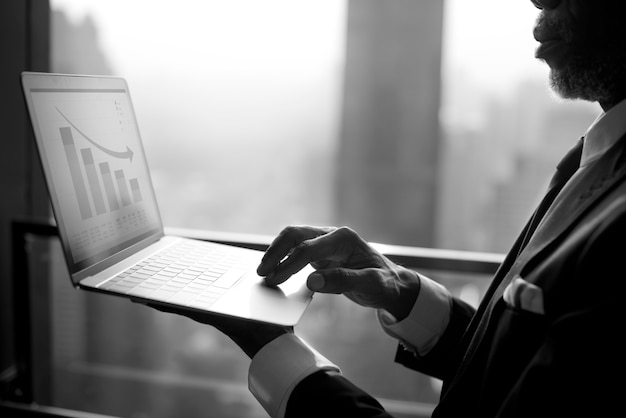 Free photo businessman is using computer laptop