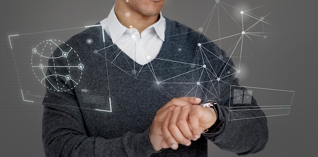 Businessman looking at his futuristic watch