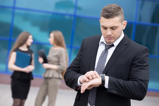 Businessman looking at his watch