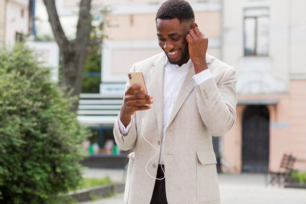 Businessman looking on smartphone