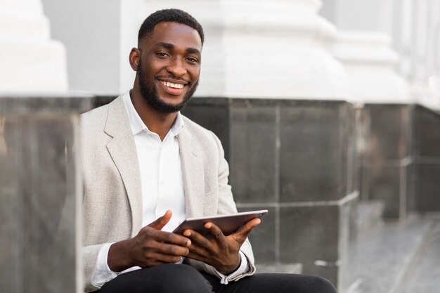 Businessman looking on a tablet