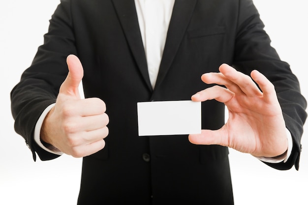 Free Photo businessman presenting business card and doing thumbs up gesture