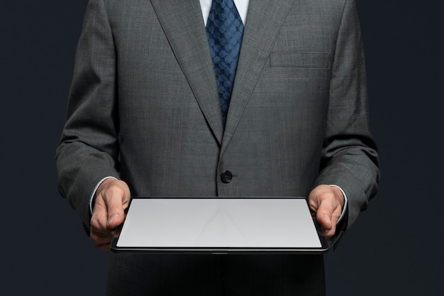 Businessman presenting invisible hologram projecting from tablet advanced technology