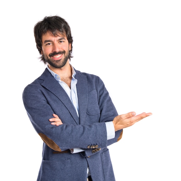 Businessman presenting something over isolated white background