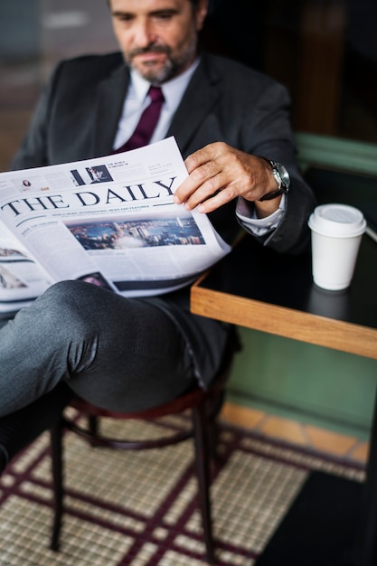 Free Photo businessman reading the daily news