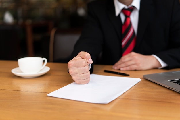 Free photo businessman ready to sign a deal at the office