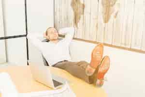 Free photo businessman relaxing in office