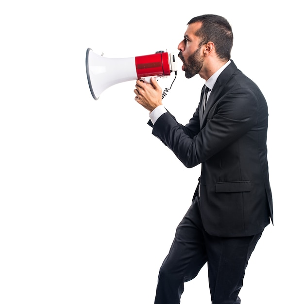 Businessman shouting by megaphone